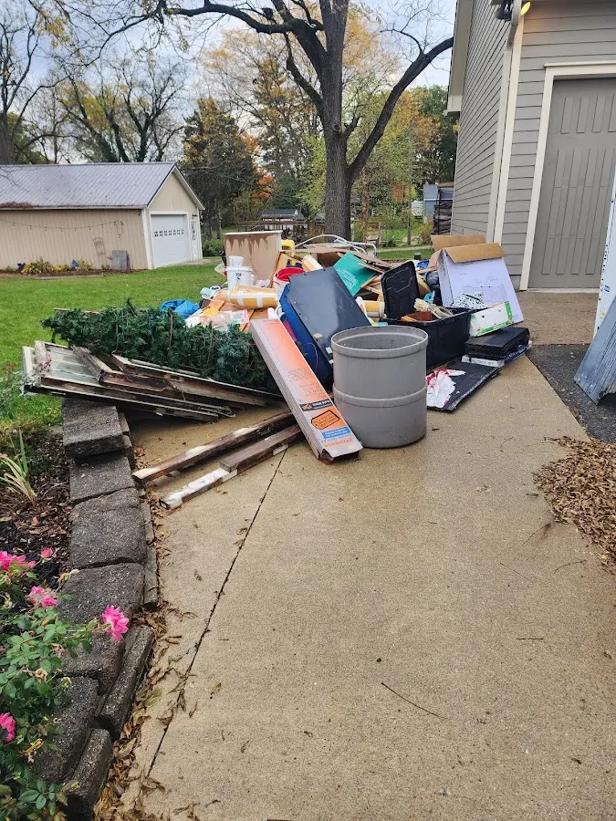 Dumpster being loaded with debris for Roofing Dumpster Rental in Port LaBelle